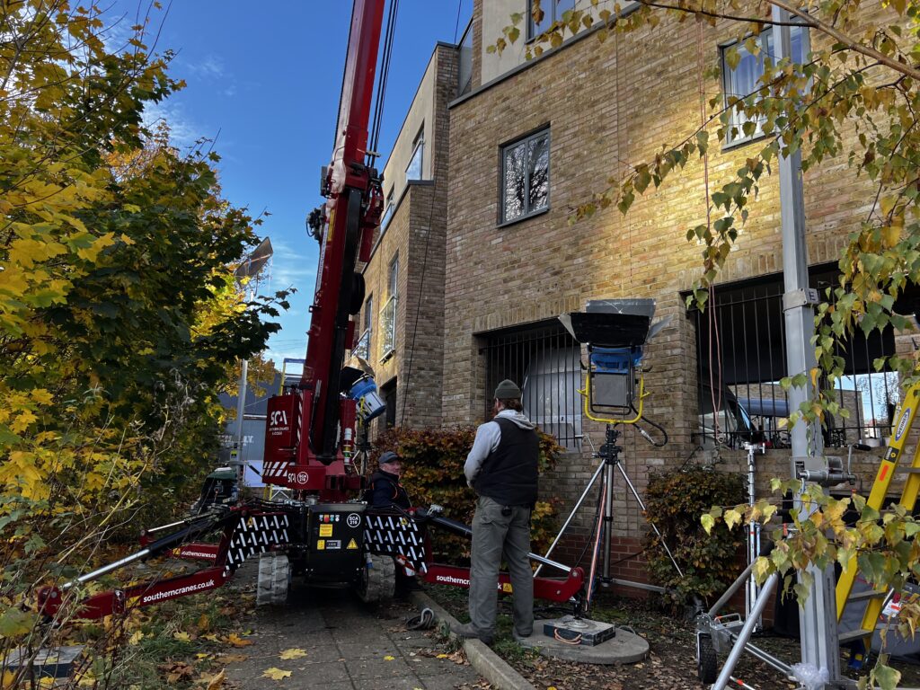A film set outside an apartment building.