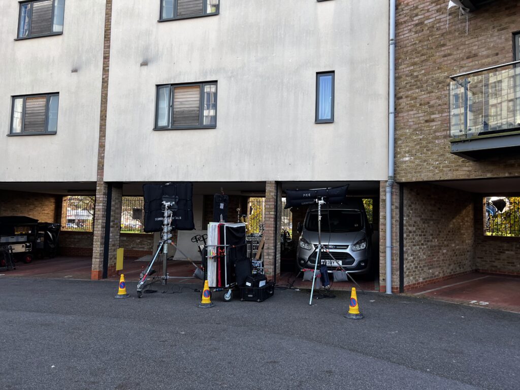 Film equipment outside an apartment building.