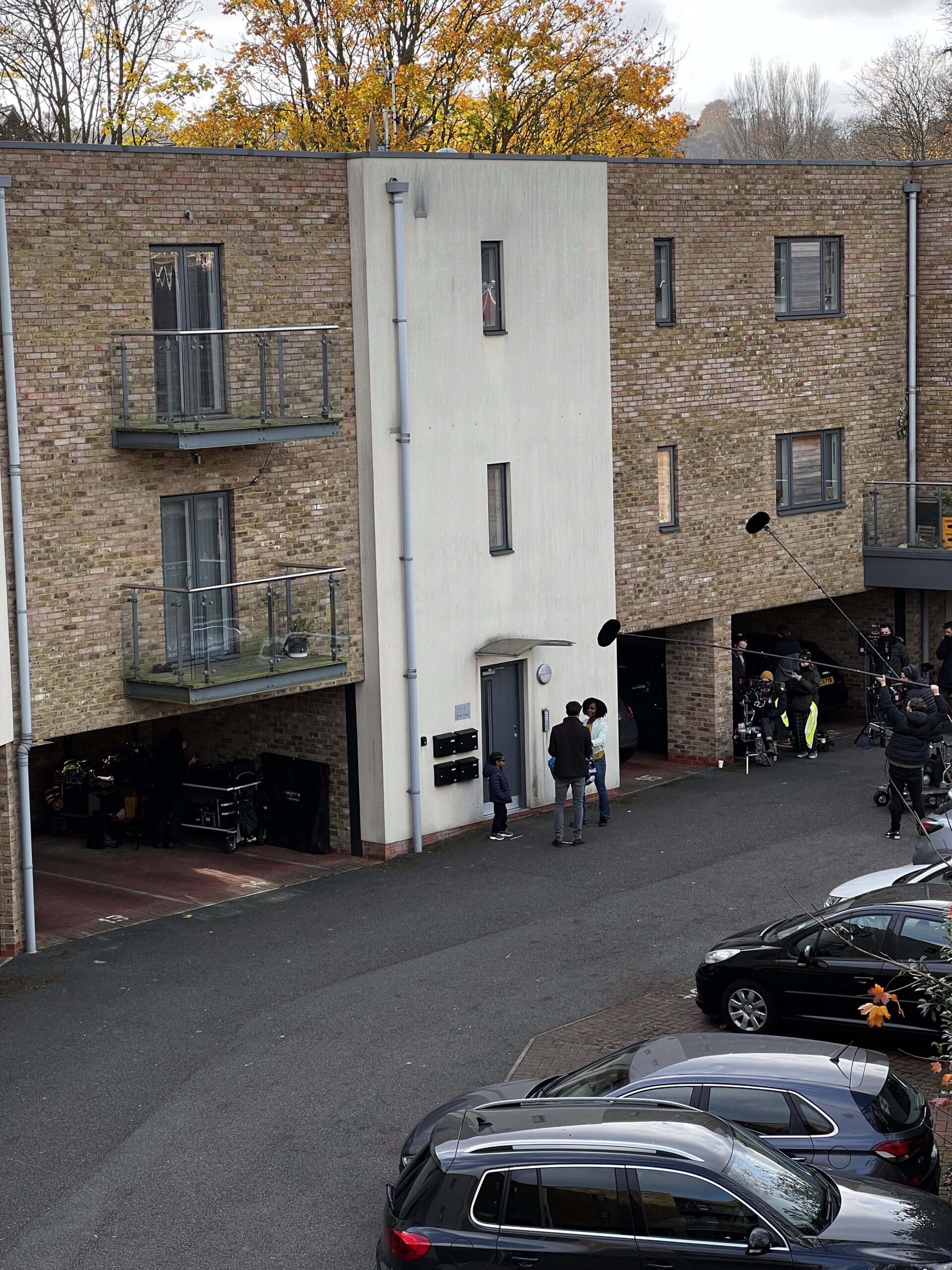 A film set outside an apartment building.