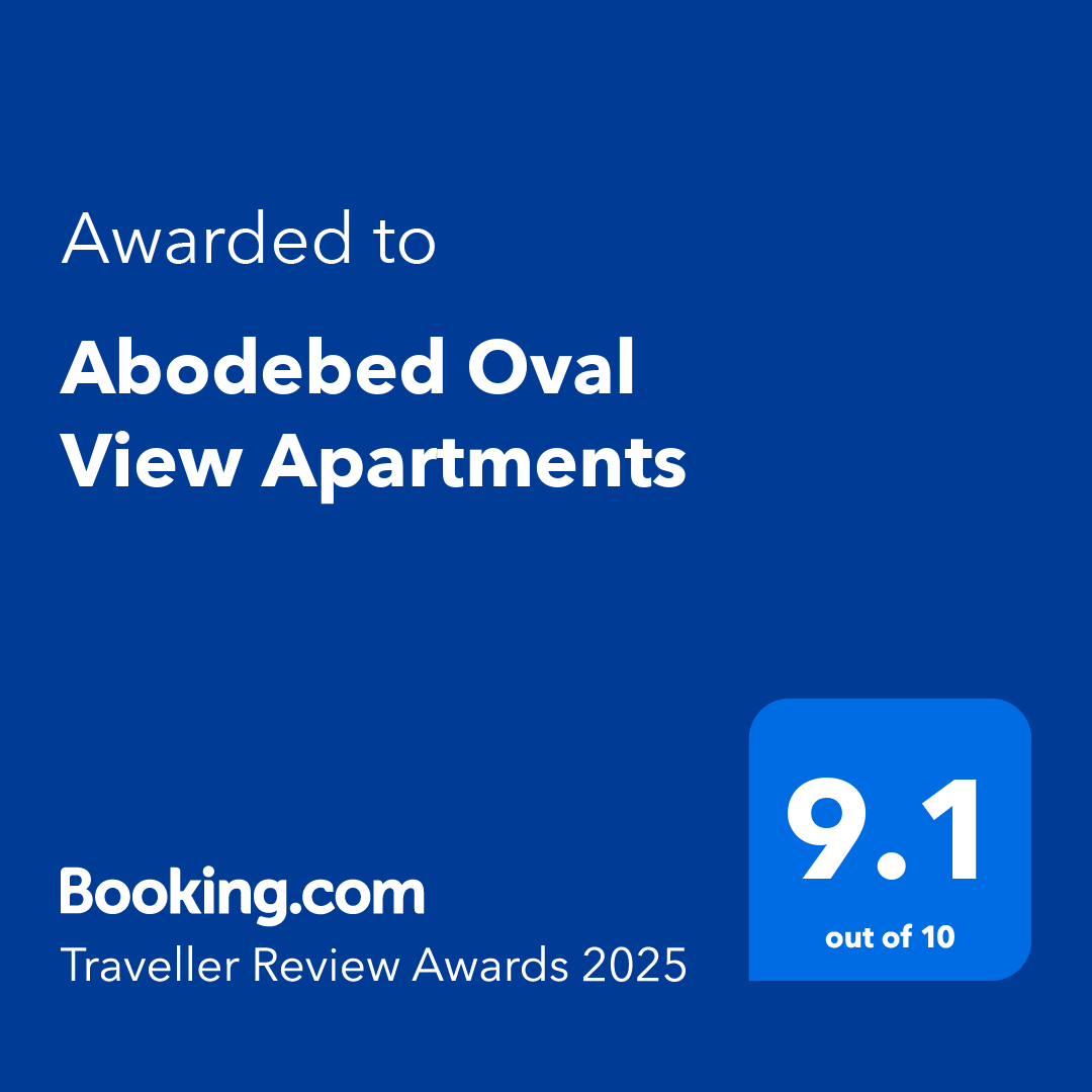 A blue certificate image showing the text: "Awarded to Abodebed Oval View Apartments" and "9.1 out of 10." At the bottom, it says "Booking.com Traveller Review Awards 2025".